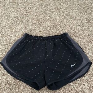 Black and gray Nike dri-fit running shorts.